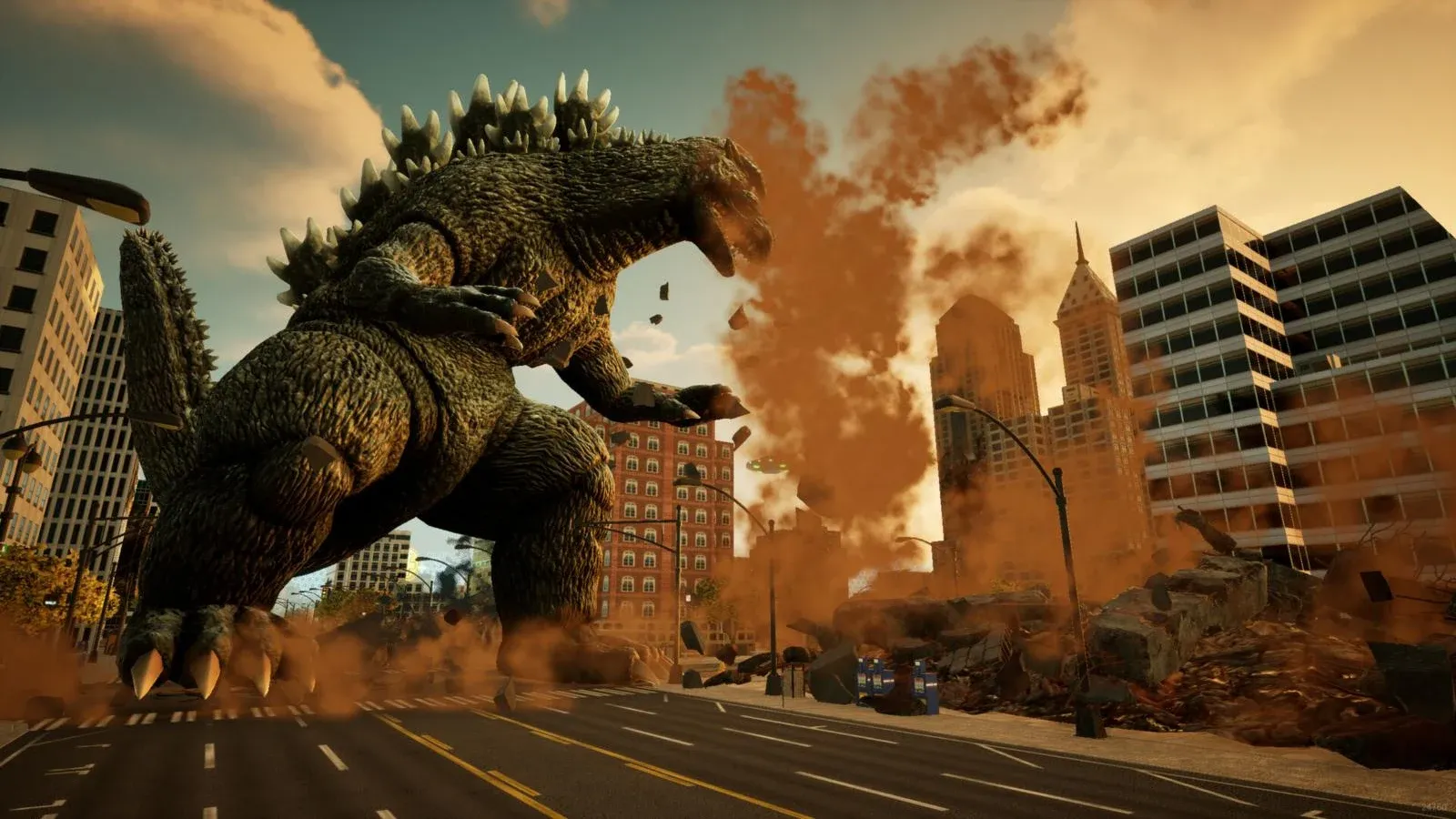 Godzilla piétine une avenue entre des immeubles en ruines, au milieu d’un nuage de poussière orange.