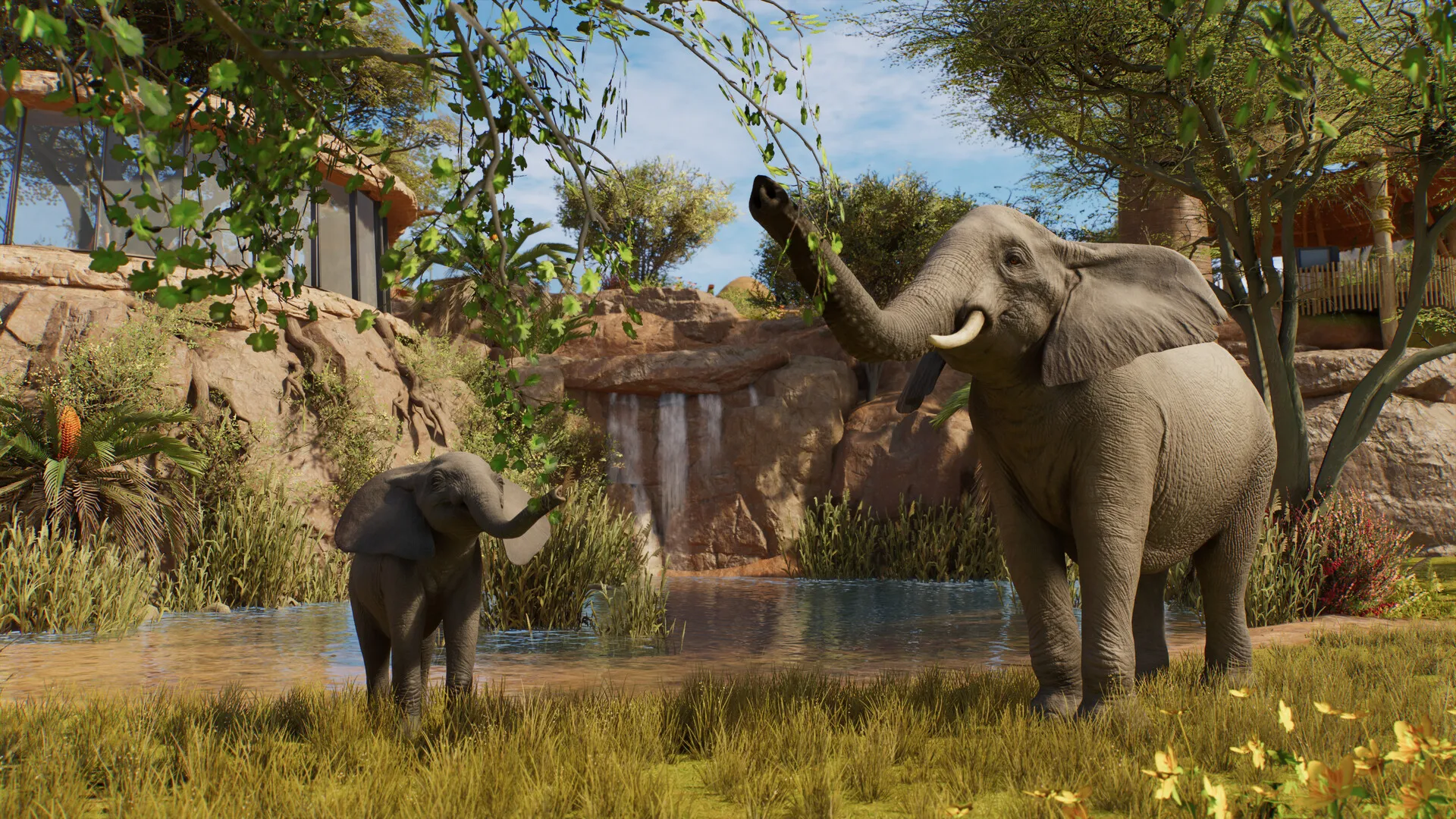 Des visiteurs traversent un tunnel vitré sous l’eau, entourés de poissons et de requins dans un aquarium de Planet Zoo 2.