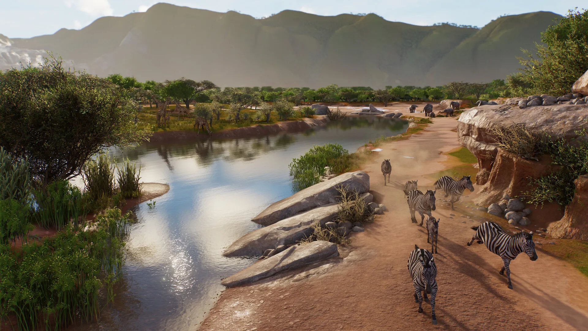 Des zèbres longent une rivière, avec des girafes et des éléphants à l’arrière-plan dans une réserve de Planet Zoo 2.